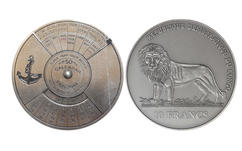 República Democrática del Congo 10 Francos 2004 Calendario Rotativo 50 Años SC Encapsulada NCV MS68